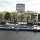 Working barge passing the Amstel Hotel.