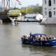 Open boat passing the Scheepvaartmuseum.