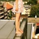 Does Emily stand on the roof and throw rocks down at those below?