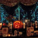 We set up in our dining room from mid-Oct to early Nov. All who come over for Samhain are welcome to add their own photos/objects/names of their dead.