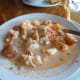 The broth was not as thick as clam chowder in Maine. The seafood included large pieces of haddock, lobster, succulent scallops, shrimp, and potatoes. It came with tasty biscuits and you can consider a bowl of this a whole meal. Yummy!