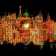 The outside of It's A Small World at night.