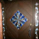 The stained glass on the door.