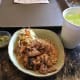 The children's chicken and rice bowl. It is brown rice, marinaded chicken, and a veggie slaw on the side. That green stuff is an aioli and is one of the sauce options for the adult version. A very well balanced and delicious meal.