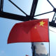 Chinese flags line each side of the Broken Bridge.