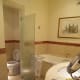 The bath and sink area through to the toilet.