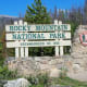 Rocky Mountain National Park sign at the start of Trail Ridge Road in Grand Lake, CO