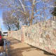 Visitors are welcome to sign the stone wall at the front of the property
