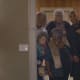 Tyler Perry stands in the doorway and adlibs.