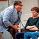 Chris Farley alongside David Spade & Christina Applegate.