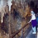 The railing offers something to hang onto as one walks through this cave at the Caverns of Sonora.