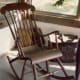 A carved three legged rocker at Little Norway