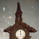 Elaborately carved clock at Little Norway
