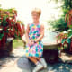 My niece sitting between urns of Chenille plants