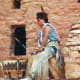 Indian beating the drum and chanting for the Indian dancers at the Manitou Cliff Dwellings.
