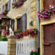 The combination of flowers against the harsh stone and masonry is really lovely!