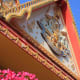 Temple decoration and a colourful display of red-pink Bougainvillea
