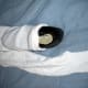 Socks will stretch to fit over the outside of shoes