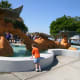 My son looks at the outdoor fountain while we wait in line to buy tickets.