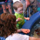 The horseshoe crab touch pool had more room to see the animals, and the animals were accessible. My four year old son looks at the underside of the crab.
