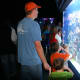 Looking at the large saltwater tank that contains clown fish, tangs, and more.