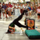 This atheletic entertainer was about to stand on his head among other acrobatic things.