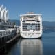 A cruise ship and the sails of Canada Place