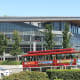 A tour bus at Canada Place with the east building of the Vancouver Convention Centre in the background