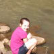 At the edge of the pool at the bottom of Waimea Falls