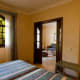 The junior suite bedroom, with views through to the lounge and bathroom