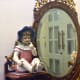 Vanity and ceramic dolls.
