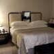 The incredibly cozy king sized bed with plenty of space to walk around all three sides.