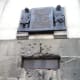 The machine gun bullet holes near the memorial.