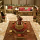 A view of the front desk area from above, with gorgeously accented seating all around.