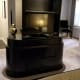 One side of the double sided, floor-to-ceiling entertainment center. This holds two televisions, one on each side.