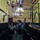 Chandeliers give light to worshippers.