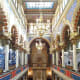 Well-lit interior of Jerusalem Synagogue.