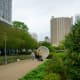 People enjoy checking out the Listening Vessels in Discovery Green Park.