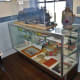 Cases of items on display at Katy RR station