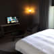 TV opposite the bed.