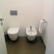 White-washed toilet area.