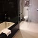 Bath, with shower and WC beyond.