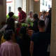 Queuing for a free potted plant.