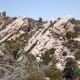These rock cliffs off to the left of the trail, topped by pine trees, were pushed up by the Pinyon Fault in the opposite direction from the rest of the canyon.