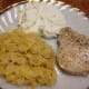Meal with pork chop. Selenium can be found in lean meats, such as pork.