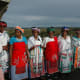 Xhosa ladies.It is important for women to look dignified at all times particularly if there is a cultural ritual. Women must cover their head at all times and have a scarf around their waist and have something to put on their shoulders. This is a sig