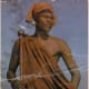 A Pondoman in his traditional garb and holding an "iqakatha"(a knob-kierrie)