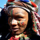 A Pondo man, in Tanzania, in full regalia and face paintings