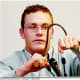 Cody demonstrates how his father abused him with a metal hay hook during the murder trial.
