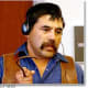 Ranch hand Pilo Vasquez, who witnessed Paul's cruelty towards Cody and corroborated Cody's claims of abuse during the trial. He is demonstrating how Paul used the large metal hook to inflict pain on Cody.
